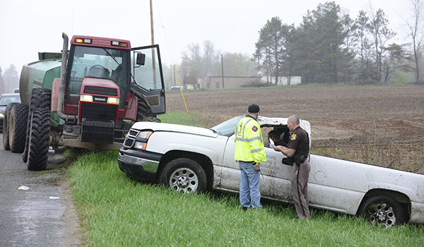 Vehicle rolls over after attempting to pass tractor